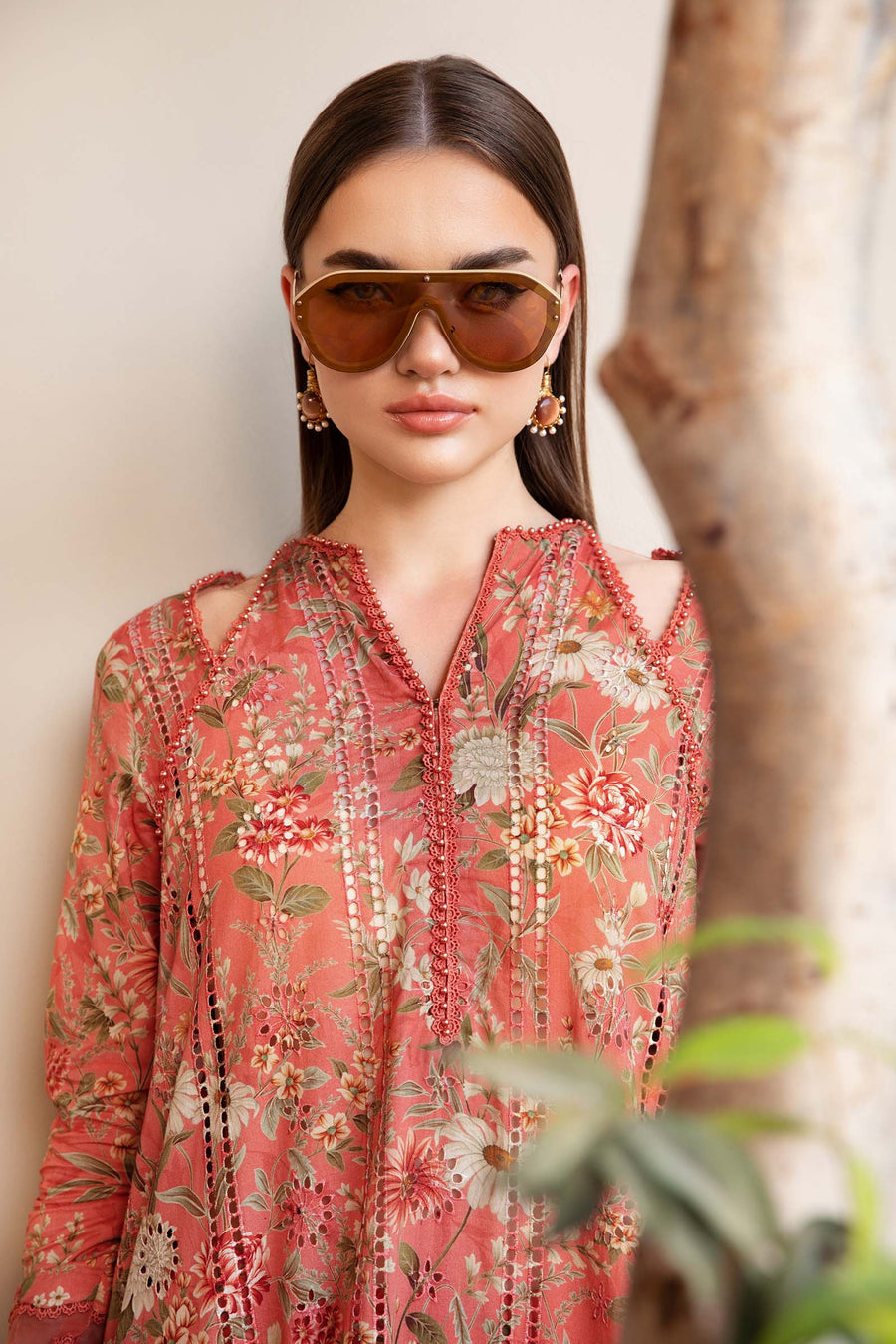 1002: Peach printed 3-piece unstitched lawn suit with embroidered shirt and chiffon dupatta.