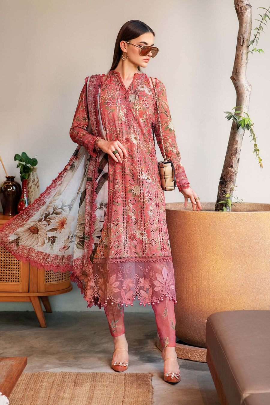 1002: Peach printed 3-piece unstitched lawn suit with embroidered shirt and chiffon dupatta.