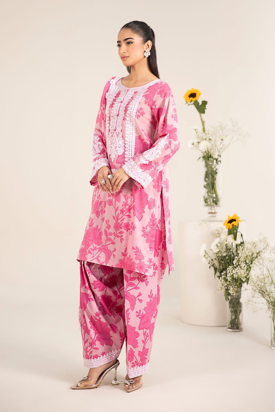 Maria B inspired 3 piece lawn suit in pink with embroidered neckline, chiffon dupatta and cambric shalwar.
