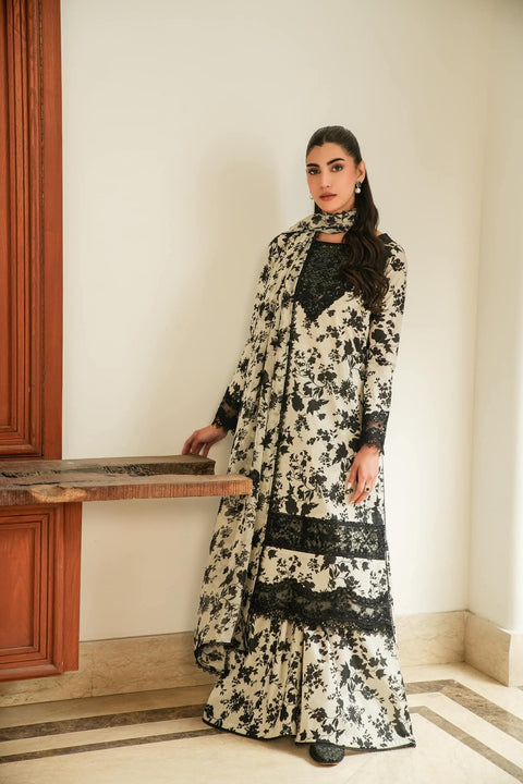 Aneela.s black skin 3-piece unstitched lawn suit with embroidered front and digital printed chiffon dupatta.