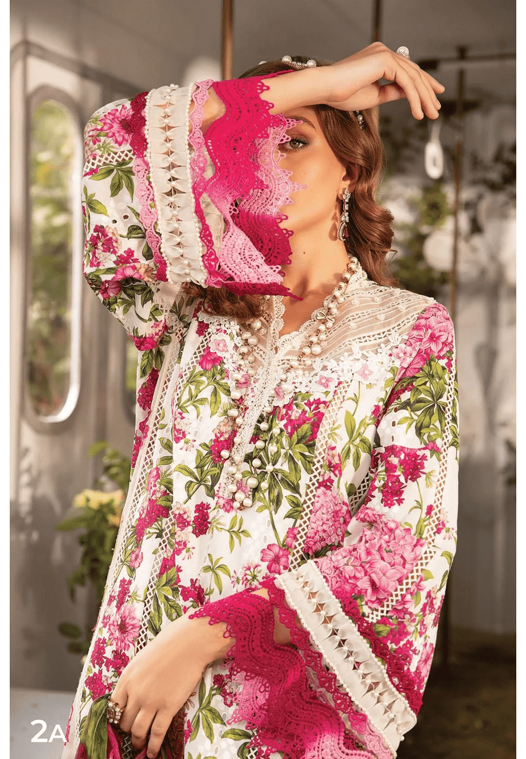 Maria B white and pink embroidered 3PC organza suit with elegant festive design.